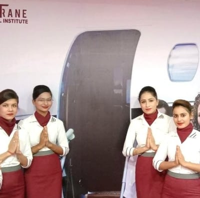 a group of women in uniform standing in front of a plane