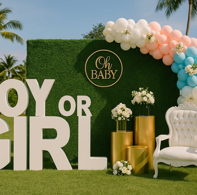 Elegant outdoor gender reveal event setup with pastel balloon decorations, floral arrangements, and luxury backdrop by Las Ca