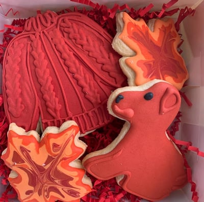 Cute fall themed sugar cookies, dogs, sweaters, and leaves. Very colorful and baked for an exciting