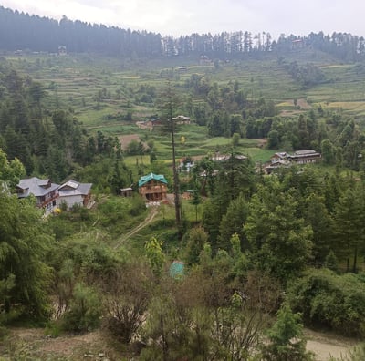 a view of a village in the mountains