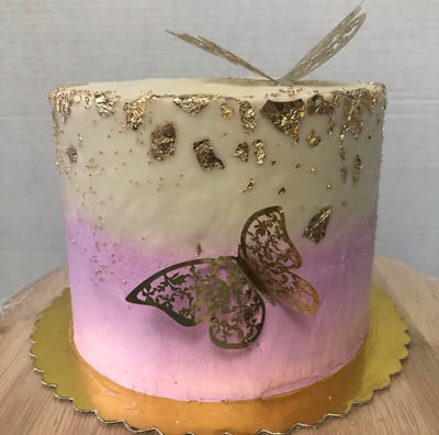 a cake with a butterfly on top of it