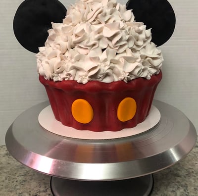 a mickey mouse cupcake with a mickey mouse ears