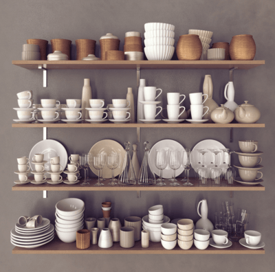 Premium crockery kit displayed on wall stand by art of kitchen