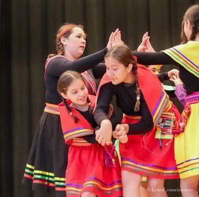 a group of young girls in colorful dresses and colorful clothes