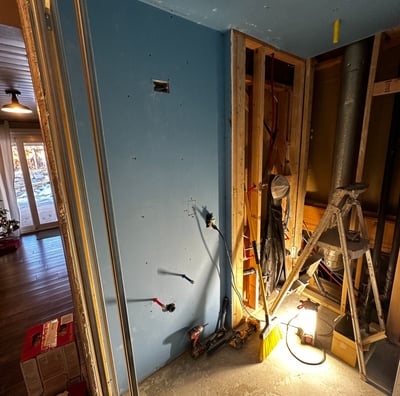 a bathroom with a ladder in it and tools