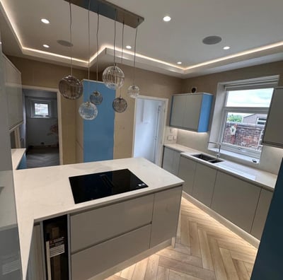 modern kitchen with led lighting and feature ceiling