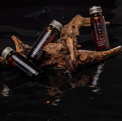a bottle of liquid in a wooden sticker