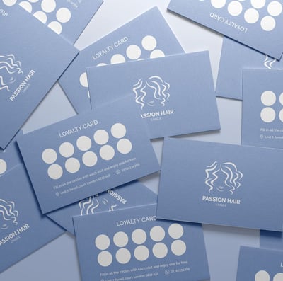 Beauty salon business cards: featuring branding elements and contact information.