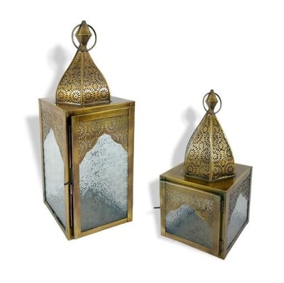 a pair of brass - plated lanterns with a glass door