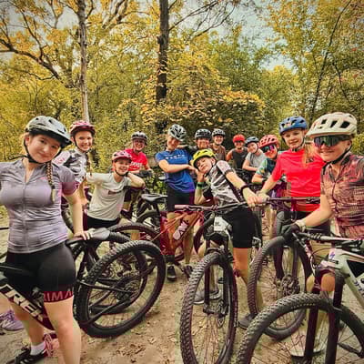 Central MTB team riding at sunset on a Twin Cities trail