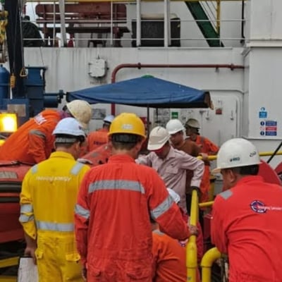 a group of people in red and yellow uniforms