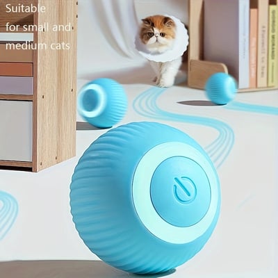 a cat is sitting on a table with a cat toy