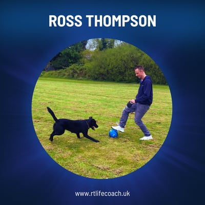 Ross Thompson Mindset Coach playing with his dog in a field.