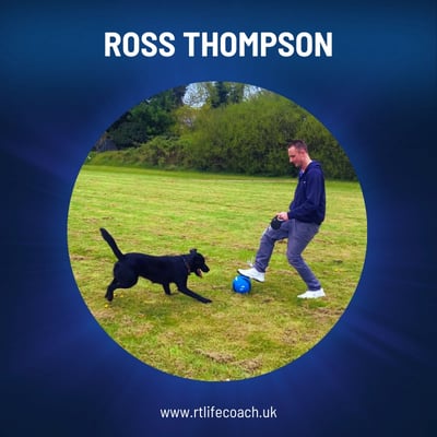 Ross Thompson Mindset Coach playing with his dog in a field.