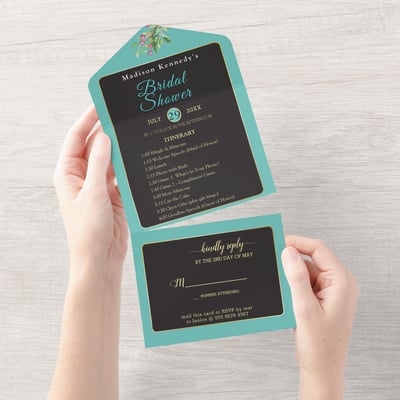 a person holding a card with a blue and white invitation
