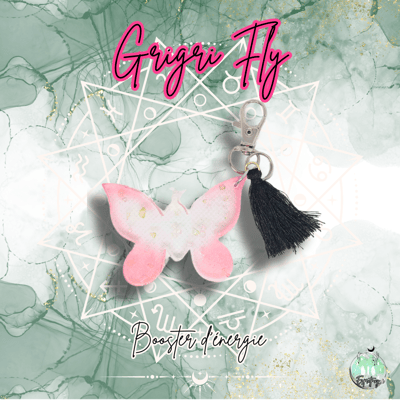 Porte clé en forme de papillon rose avec ponpon noir