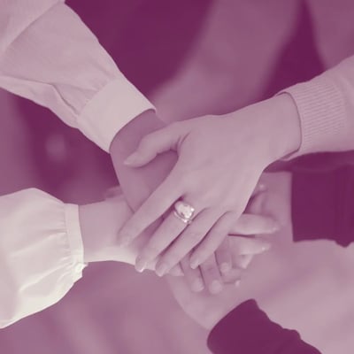 Women holding hands together for Trust