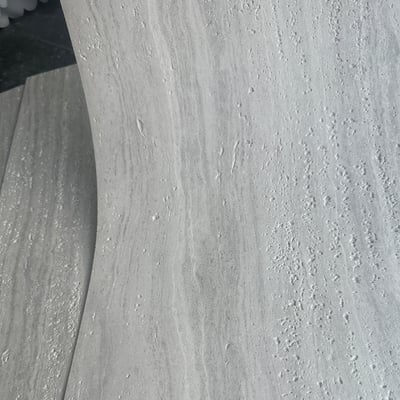 Detailed view of Maya Travertine soft stone with 3D-printed patterns and ultra-thin design.