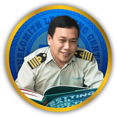 Photo of Mr. Reno A. Ewican on a circle gold frame with Shelomith Learning Center Logo background.