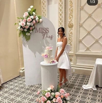 Bridal shower backdrop with a miss to mrs sign