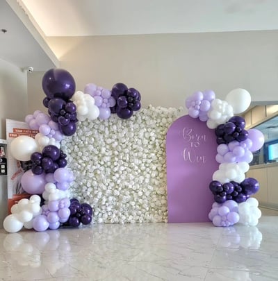 Born to win themed balloon backdrop paired with our white rose flower wall