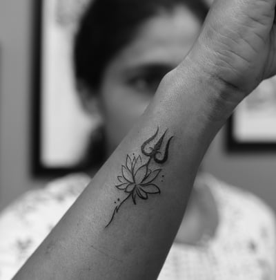 Spiritual Trishul and Lotus tattoo design by Dudo’s Tattoos and Piercing Hyderabad