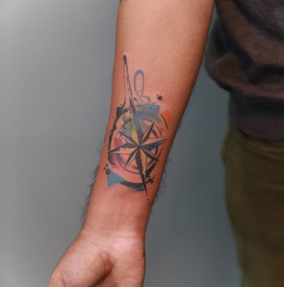 Watercolor abstract Compass tattoo by Dudo's Tattoos Hyderabad