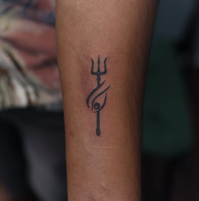 Spiritual Trishul and Third eye tattoo design by Dudo’s Tattoos and Piercing Hyderabad