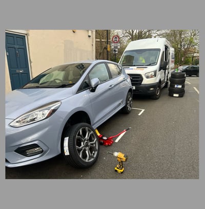 a car tyre got changed at roadside by mobile tyre fitting unit