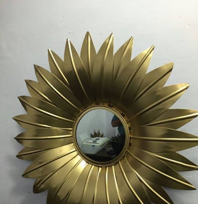 a Brass sunflower with a mirror