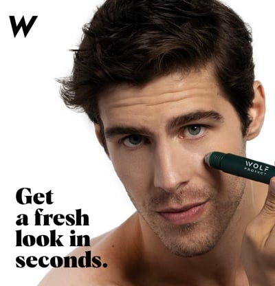 a man with a green sticker concealer