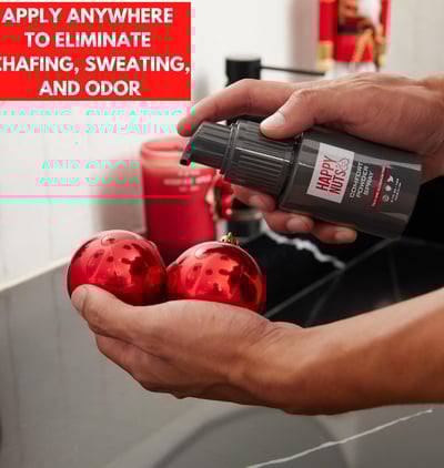 a person holding comfort spray deodorant for men from happy nuts