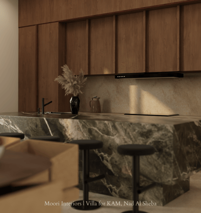 Modern kitchen island featuring dark green marble and wooden cabinetry.