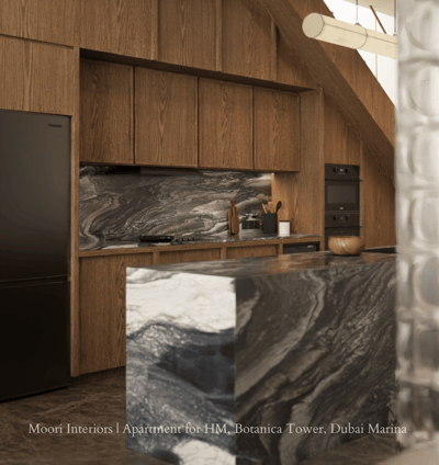 Modern kitchen with wooden cabinetry, black marble island, and a black refrigerator.