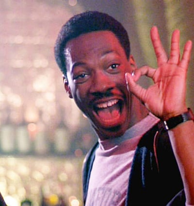 a man flashing the okay symbol