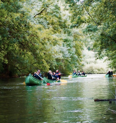 charente a group of people in canoes on a river