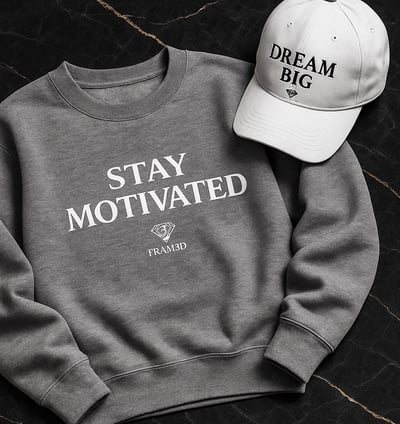 a crewneck with a baseball cap on it with motivational sentence