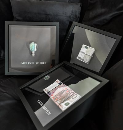a frame of money and a frame with lightbulb for motivation