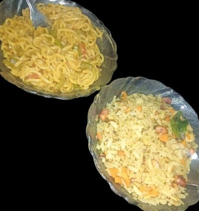 alt="Combo of Poha and Maggie served in bowls, featuring puffed rice, onions, tomatoes, green chilli