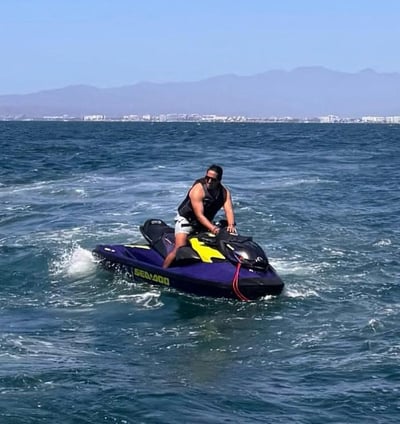 a man riding a jet ski in the ocean