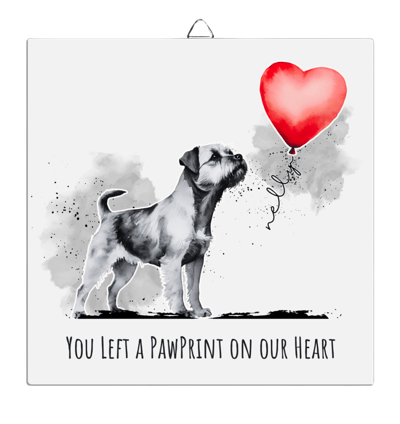 a dog with a balloon in the shape of a heart