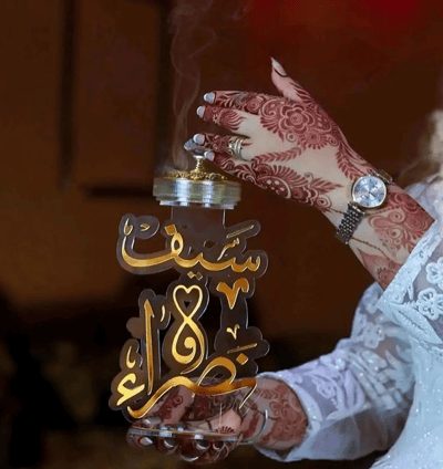a woman in a white dress holding a small clock