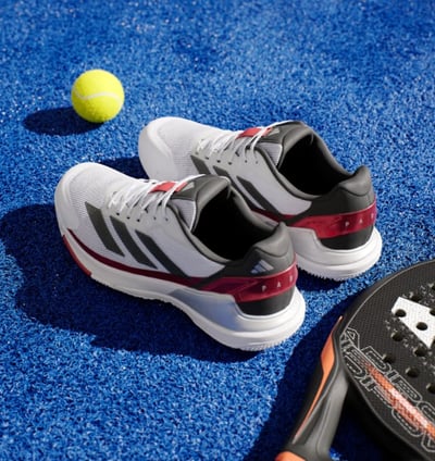 a tennis racket and a tennis racket on a blue carpet