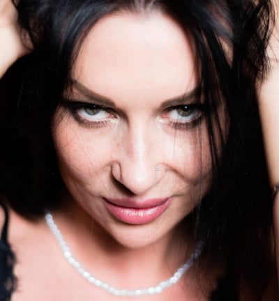 a woman with a necklace and a necklace