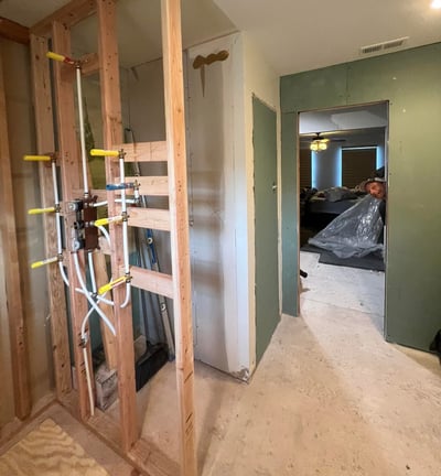 a bathroom remodel with a ladder 