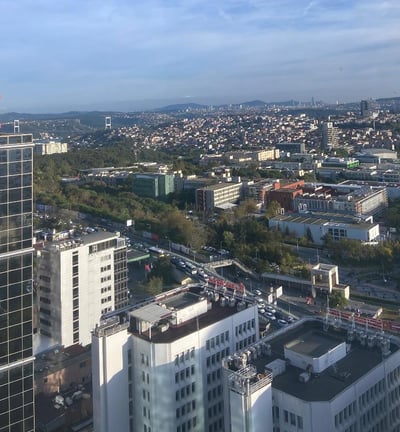 a city skyline view of a city with a clock tower