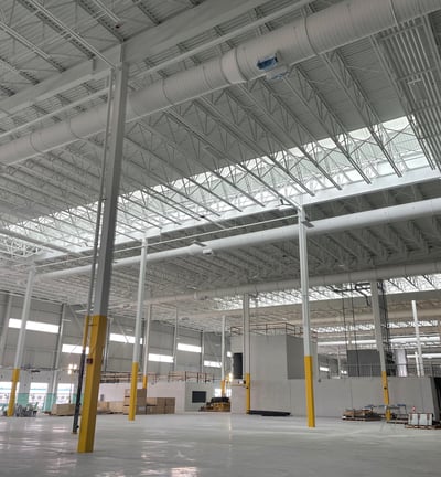 a large warehouse with a lot of pipes and pipes