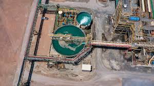 a large zinc processing plant with a lot of tanks