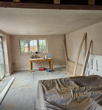 Plastering a living room wall in Worcester, smooth finish by local experts D and N Plastering.