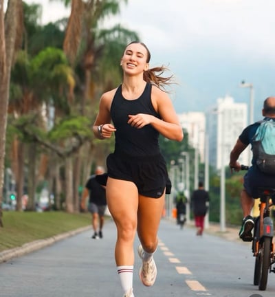 a woman running on a bike and a man riding a bike
